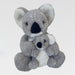 Two plush koala toys stacked on a light gray background
