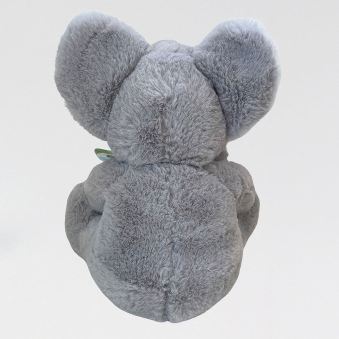 Gray plush elephant toy on a light gray background