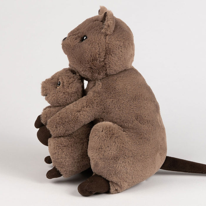 Two brown plush quokkas hugging each other on a white background