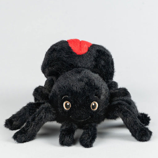 Black plush spider toy with red marking on a white background