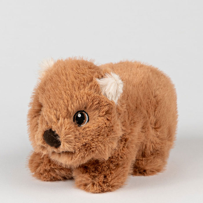 Brown plush wombat toy on a white background