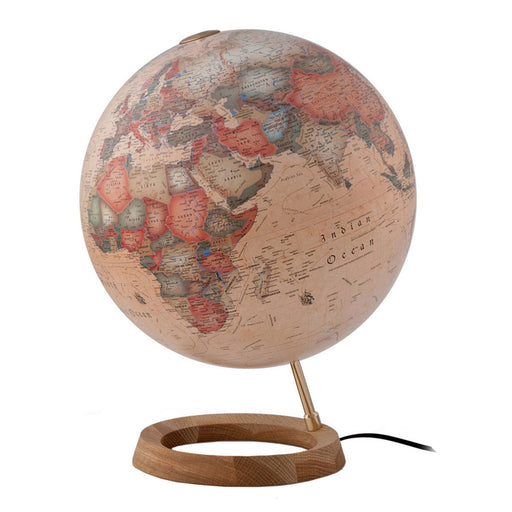 Decorative globe with wooden base on a white background