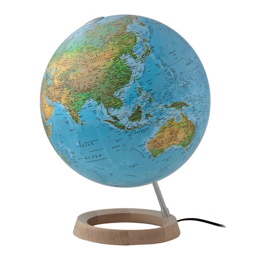 World globe with wooden base on a white background
