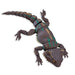 Toy bearded dragon figure on a white background