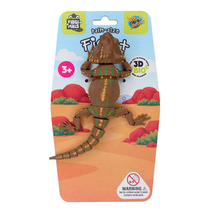 Toy figure of a bearded dragon in packaging with branding on a white background