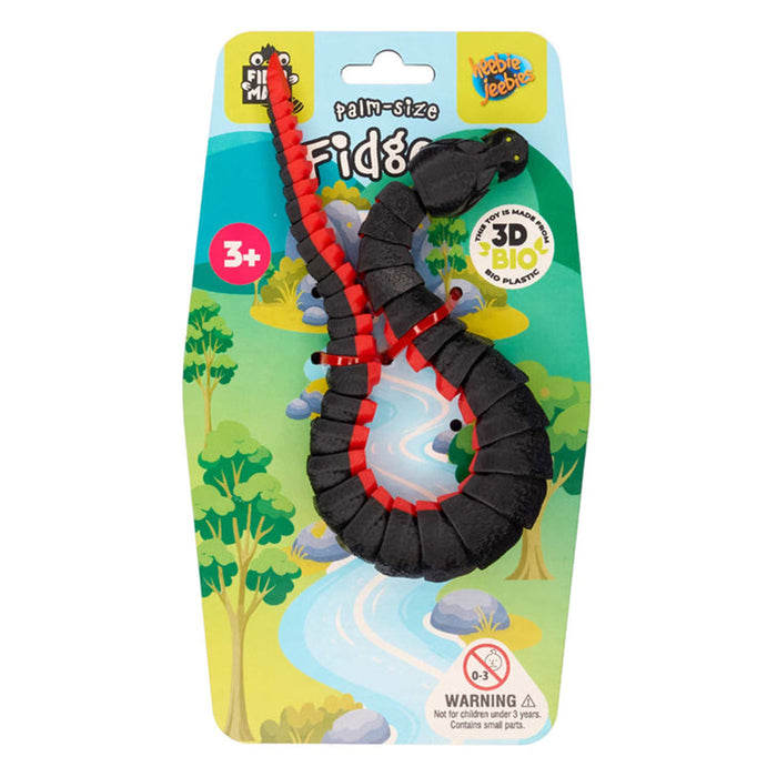 Fidget toy with red accents in its packaging on a white background