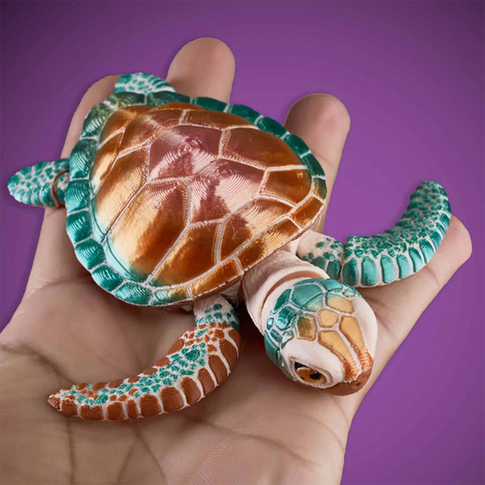 Hand holding a small turtle figurine against a purple background