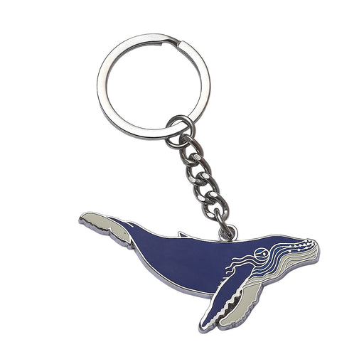 Keychain with a blue and silver whale design on a white background