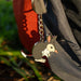 Keychain with a bilby design attached to a bag outdoors.