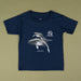 A navy blue short-sleeve t-shirt with a graphic print of a humpback whale and the text '40 Years Australian Geographic' on the front, laid flat on a solid olive-beige background.