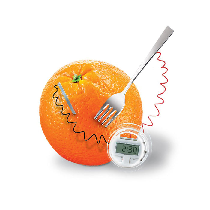 Orange with a digital thermometer and fork on a white background