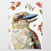 Decorative tea towel with a floral and nature-themed design on a white background