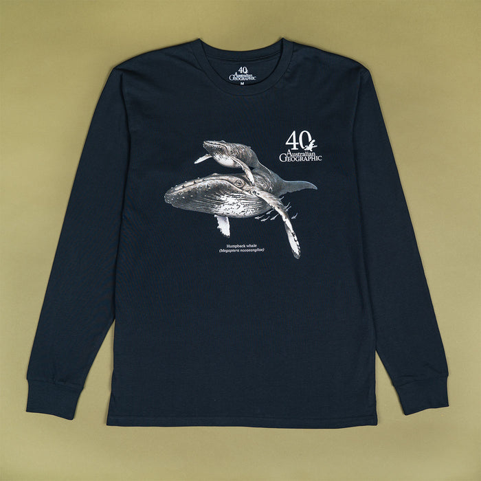 A dark navy long-sleeve t-shirt with a whale graphic and '40th Australian Geographic' text on the front, laid flat on a solid olive-green background.