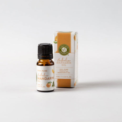 Mandarin essential oil bottle and packaging on a white background