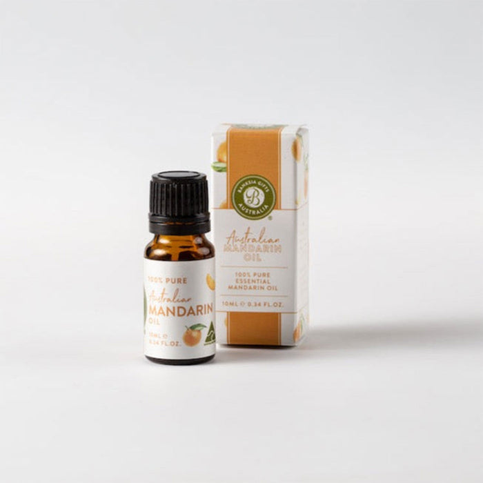 Mandarin essential oil bottle and packaging on a white background