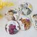 Set of decorative plates with animal illustrations on a light background