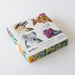 Box of coasters with Australian-themed illustrations on a white background