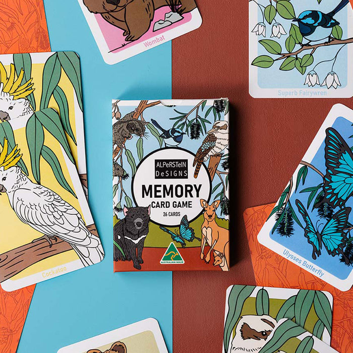 Memory card game box surrounded by animal-themed playing cards on a colorful background