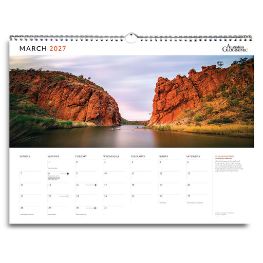 A single-page March 2027 wall calendar spread from Australian Geographic, featuring a large landscape photograph of a red rock canyon and river, with the calendar grid and text blocks below on a white page.