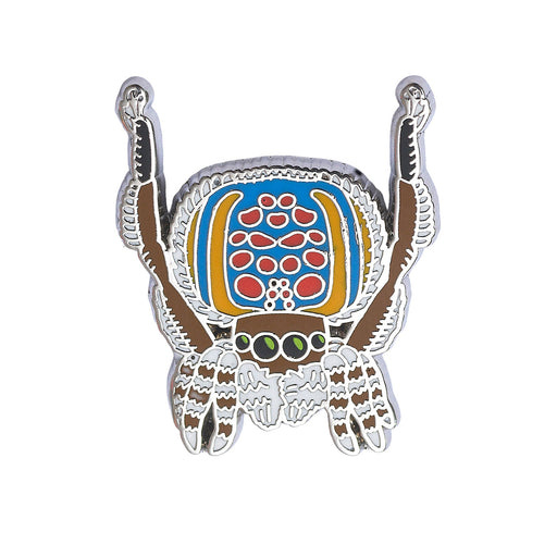 Colorful crab-shaped badge with a decorative shell on a white background