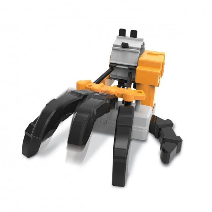 Toy construction vehicle with black tracks and orange and gray body on a white background