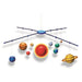 Model of a solar system with planets on a rod against a white background