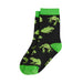 A pair of black crew socks with a green pixelated frog pattern, bright green toes, heels, and cuffs, and the partial text 'IT'S IN' printed on the side.