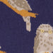 Close-up of a sock with tawny frogmouth design on a dark background