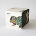 Box with a design of a wombat wearing a floral wreath on a white background