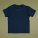 A plain navy blue short-sleeve t-shirt laid flat against a solid olive green background.